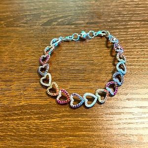 Sterling silver mutli stone continuous heart bracelet with magnetic clasp.